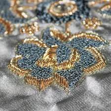 Patterns or pictures that consist of stitches sewn directly onto cloth: Zardozi Wikipedia