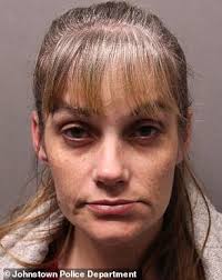 Woman accused of hiding roommate's rotting corpse after she died of  overdose