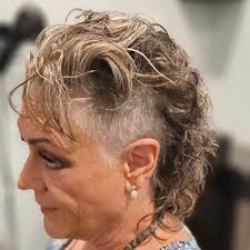 Love this fun faux hawk, with her natural curl it's a quick easy style. Let  us help you find the perfect look for you!