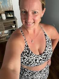 Zoe Saldana wears self-portrait CHARCOAL BLACK ROSE JUMPER & BLACK LEATHER  MIDI SKIRT