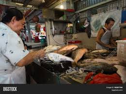The fishmonger's distinctive giggles signal her mating intent and validate the man's poor conversational content. Singapore September Image Photo Free Trial Bigstock