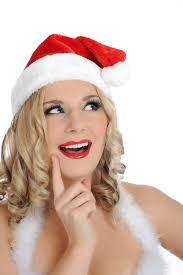 Donna Di Natale in Santa Hat Che Fa Un Segno Di Silenzio Immagine Stock
