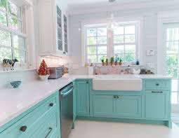 A muted green cabinet color adds depth and interest to the kitchen, while a butler sink and butcher block countertop adds a level of country chic. Custom Kitchen With Turquoise Cabinets Home Bunch Interior Design Ideas