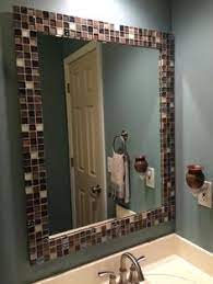 A video showing tool and process of cutting and gluing mirror glass tiles 22 Tile Around Mirror Ideas Tile Around Mirror Bathroom Decor Bathrooms Remodel