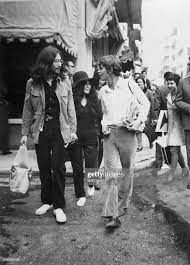 Musician John Lennon Strolls With His Wife Yoko Ono And His Greek John Lennon And Yoko John Lennon John Lennon Yoko Ono