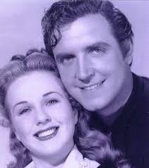 Robert Paige, a "B" Hollywood leading man who had the requisite tall, dark  and handsome features (plus an excellent singing voice) that Hollywood  often relied upon, Robert Paige was an extremely capable