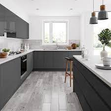 Grey modern industrial style apartment interiors made plush with stylish sofas, modern lighting, bespoke furniture designs, cool artwork & chic home accessories. Kielder Grey Wood Effect Matt Wall And Floor Tile 150mm X 600mm 150mm 600mm Effect Floor Grey Modern Grey Kitchen Grey Kitchen Floor Grey Kitchen Designs