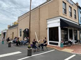 Small american breakfast diner exterior view. Restaurants Reopening City Streets Close To Create More Dining Room