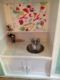 tv stand turned into play kitchen