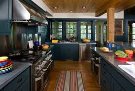 Brown kitchen offers white appliances and wooden cabinetry matching with the breakfast island that blends in with the hardwood flooring. 31 Awesome Blue Kitchen Cabinet Ideas Luxury Home Remodeling Sebring Design Build