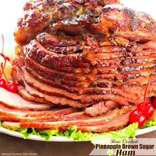 A spiral sliced ham is glazed with brown sugar and ground cloves and cooked right in your slow cooker which frees up needing to use your oven at the holidays. Slow Cooked Pineapple Brown Sugar Glazed Ham Melissassouthernstylekitchen Com