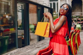Bags are also often a style statement for women everywhere. Free Photo Exited Black Woman With White Shopping Bag Standing Over Yellow Background Trendy Spring Fashionable Look