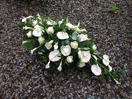 Casket Spray Anthuriums Calla Lilies And Avalanche Roses Funeral Flowers Memorial Flowers Funeral Flower Arrangements