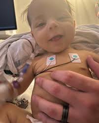 Why I'm Still Here… By Ashley Bayliss-White This photo is everything. It  was Christmas Eve. My son Andrew had just come out of the ICU after two  long weeks in the ICU.