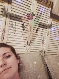 Repurposed shutter headboard with hand-painted lights