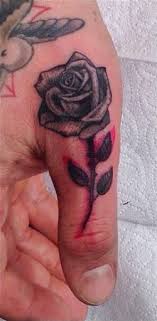 Dainty dog paw finger tattoo. Black Rose Tattoo On Finger Best Tattoo Ideas