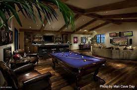Modern industrial furniture vintage industrial decor industrial metal man cave wall art wood wall art wood games game room decor weathered wood rustic wood. Huge Basement With A Rustic Touch Thanks To The Dark Hardwood Floors Wood Beams Across The Ceiling And Da Man Cave Home Bar Pool Table Room Man Cave Basement