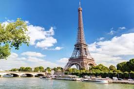 The eiffel tower is an iron tower built on the champ de mars beside the river seine in paris. Why Sharing Photos Of The Eiffel Tower At Night Is Technically Illegal