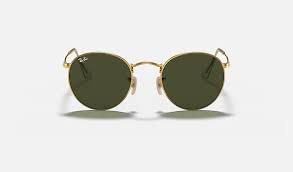 She shielded her eyes from the rays in a pair of gold rimmed ray ban shades, while further accessorising with a selection of gold bracelets. Ray Ban Round Metal Rb3447 Gold Metal Green Lenses 0rb344700150 Ray Ban Usa