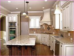 Mixing cabinet finishes works best with strongly contrasting colors so that there is no question that these cabinets are very different. White Appliances With Off White Cabinets Google Search Antique White Kitchen Antique Kitchen Cabinets Glazed Kitchen Cabinets
