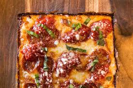 Put the pizza dough in the pan and gently stretch it out to fit so the dough reaches the corners. Smoke S Detroit Style Dough Recipe Recipes Pizza Today
