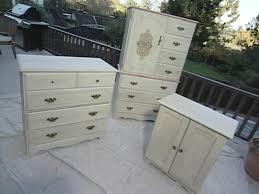 How To Lighten Dark Bedroom Furniture With Paint How Tos Diy A round cut out in drawer and door front acts as the pull, the elimination of material creating function and visual appeal.