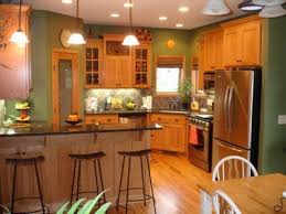 Kitchen Paint Colors With Wood Cabinets Honey Oak Kitchen Cabinets With Black Countertops And Gree Green Kitchen Walls Kitchen Wall Colors Oak Kitchen Cabinets