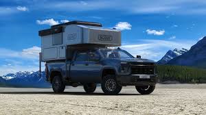 We could barely get inside to even videotape this small camper with a bathroom. Scout Campers Kenai Truck Topper Has A Full Bathroom Queen Size Bed