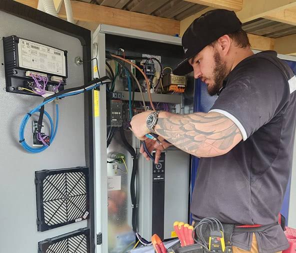 Electrician installing modern chrome smart light switch plate in Crayford