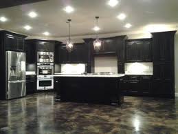 Distressed black cabinets add a bit of yesteryear charm in a kitchen that's both thoroughly modern and timeless in style. Black Distressed Kitchen Cabinets Gallery