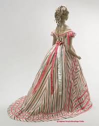 The hair is plated behind, and dressed in loops. Late 1860s Ball Gown I Believe This Is Housed In The Musee Galliera Fashion Historical Dresses Vintage Gowns