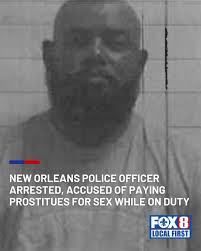 New Orleans police officer Terrance Johnson, 56, was booked Wednesday