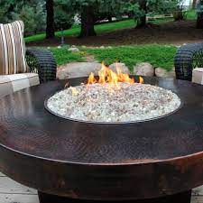 Propane fire pits are powered by a liquid propane tank which is often stored in a drawer or closet. Oriflamme Round Hammered Copper Firepit Frontgate
