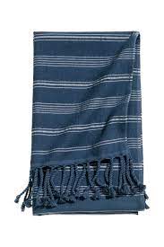 The bath towel, hand towel, and washcloth are all adorned with narrow blue stripes. Striped Bath Towel Dark Blue White Striped H M Home H M Us Striped Bath Towels Blue And White White Towels