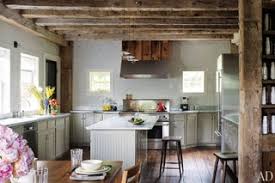 Mounting a wooden cabinet that has glass doors on top of a white cabinet with a polished wood countertop makes you feel the later atmosphere. Rlc0hmyjxhq5hm