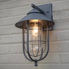 Home Decorators Collection Wisteria Collection 1 Light Sand Black Outdoor Wall Lantern Sconce With Clear Glass Shade 17547 The Home Depot