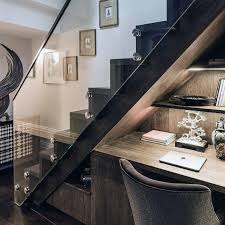 Above the living area is a cantilevered bed pavilion that projects out into the main space, supported on steel beams. Top 70 Best Under Stairs Ideas Storage Designs