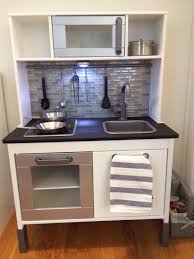 If yours is already assembled, remove the doors, sink, and stove to make. Ikea Play Kitchen Hack Sand Counter W 200 Grit Stain W Minwax Polyshades Spray Paint Body White Oven Door Ikea Play Kitchen Diy Play Kitchen Play Kitchen