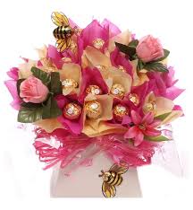 Beautiful desserts, sweets and candy table. Ferrero Rocher Truffle Bouquet With Silk Flowers Chocolate Gift Bouquet