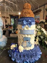 If you need advice about organising flowers for a funeral, give our waitrose florist specialists a call on 0800 188 881. Baby Bottle Flower Tribute Flower Arrangements Funeral Tributes Funeral Flower