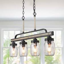 These modern hanging lights are a more traditional, circular form, drum pendant lighting can be adapted for use in a range of design settings from modern, industrial, rustic, or vintage. Lnc Araphi 4 Light Dark Gray Modern Farmhouse Chandelier Rustic Linear Island Glass Jar Pendant Light Faux Wood Accent A03512 The Home Depot In 2021 Mason Jar Chandelier Rustic Pendant Lighting Jar Chandelier