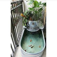 Bentuk bujur sangkar dibagi menjadi empat bagian dan salah satu bagiannya dijadikan tempat untuk bangku taman. 7 Desain Kolam Ikan Koi Minimalis Yang Sederhana