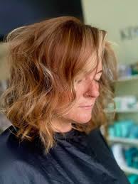 Hairstylist specializing in blonding and textured haircuts