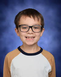 Can someone change the color of his shirt and fix his hair? The school let  him take off his nice shirt right before he took pictures and it messed up  his hair