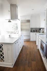 Most of the kitchen flooring options out there are featured in light that doesn't do the design any favor, or treat the kitchen floor as an afterthought. Ililexy S Image Wood Tile Floor Kitchen Wood Tile Kitchen Wood Look Tile Floor