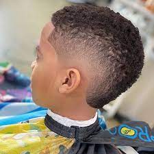 Use two contrasting dyes like black and red on both sides of the head to create the middle part that the eboy haircut utilizes. Black Boys Haircuts And Hairstyles 2021 Update Menshaircuts Com Black Boys Haircuts Boys Haircuts Black Boys Haircuts Kids