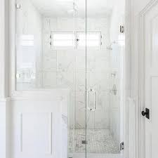 One look at the subtle embellishments in the vanity structure, and. Carrera Marble Shower Tiles Design Ideas
