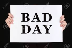 Woman Holding Poster With Text Bad Day In Front Of Her Face Isolated..  Stock Photo, Picture And Royalty Free Image. Image 51252553.