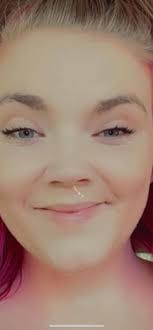 A 21-year-old woman was arrested early Wednesday morning following a knife  attack outside of a Derby strip club, police say.