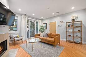 Modern Living Room With Recessed Lighting Hardwood Floors Floor To Ceiling Windows Sandstone Tile F Modern Living Room Rugs In Living Room Recessed Lighting